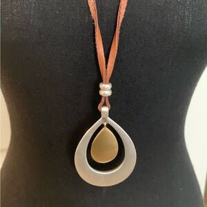Lucky Brand two tone pendant necklace 30” leather cord. READ